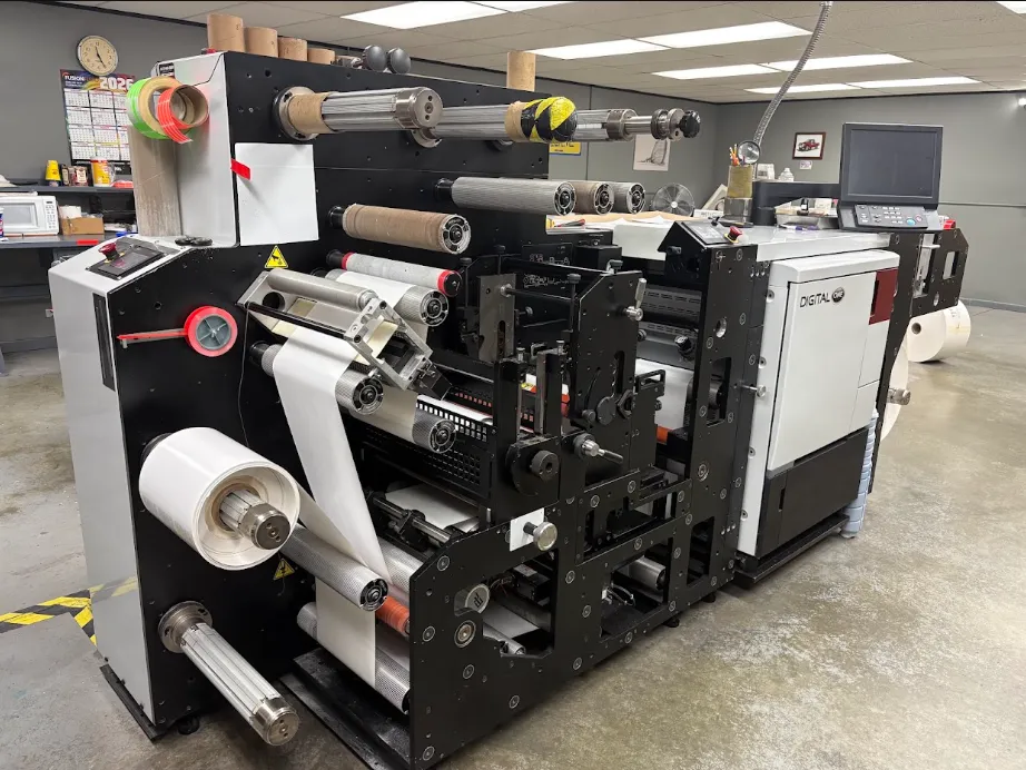 Close-up of modern digital label printing and finished label roll (placeholder manufacturing photography)