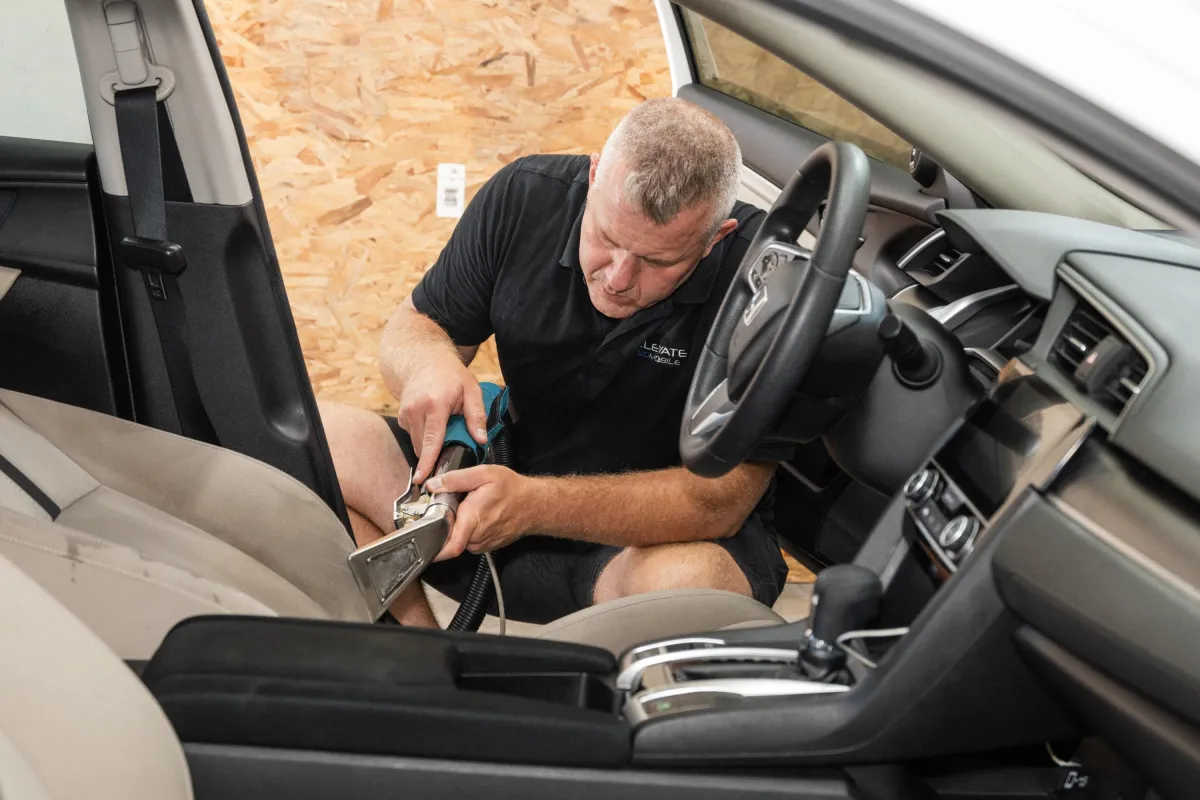mobile detailer cleaning car interior