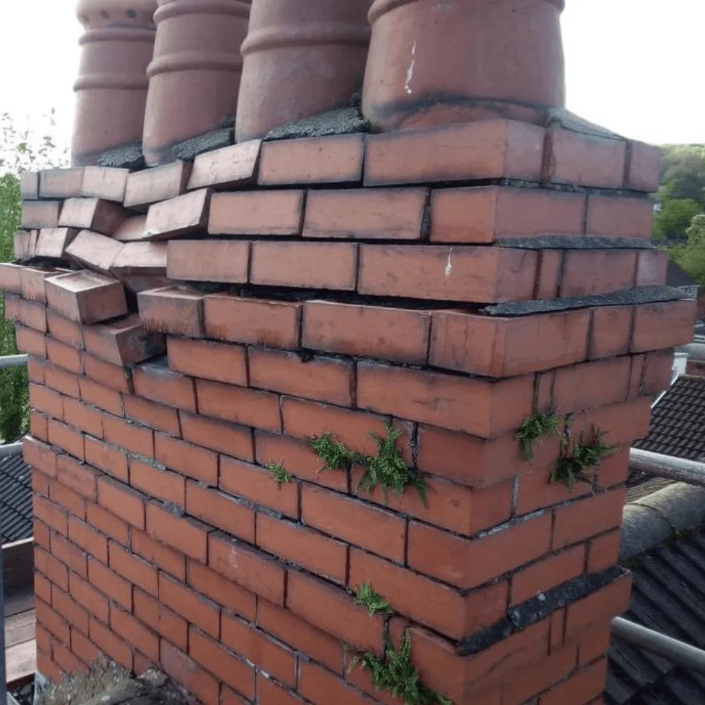 A brick chimney that has been damaged