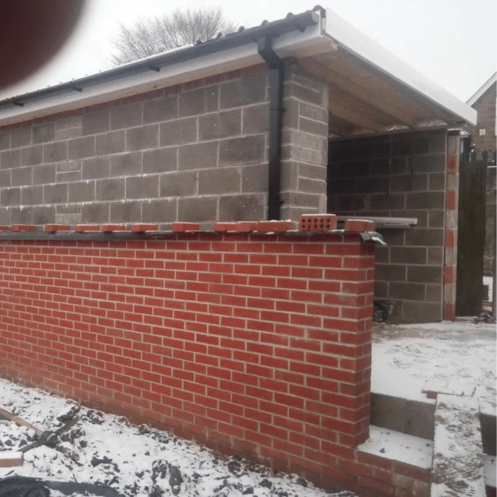 We built this block garage with a newly built red brick wall next to it