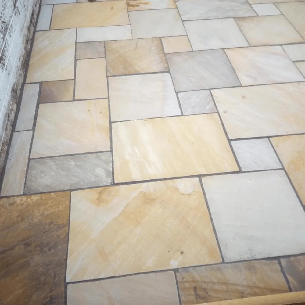 Freshly laid light brown patio slabs