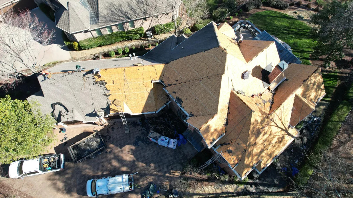 Emergency roof repair completed on a residential roofing project, showcasing perfect patching by Your Neighbor's Contractor.