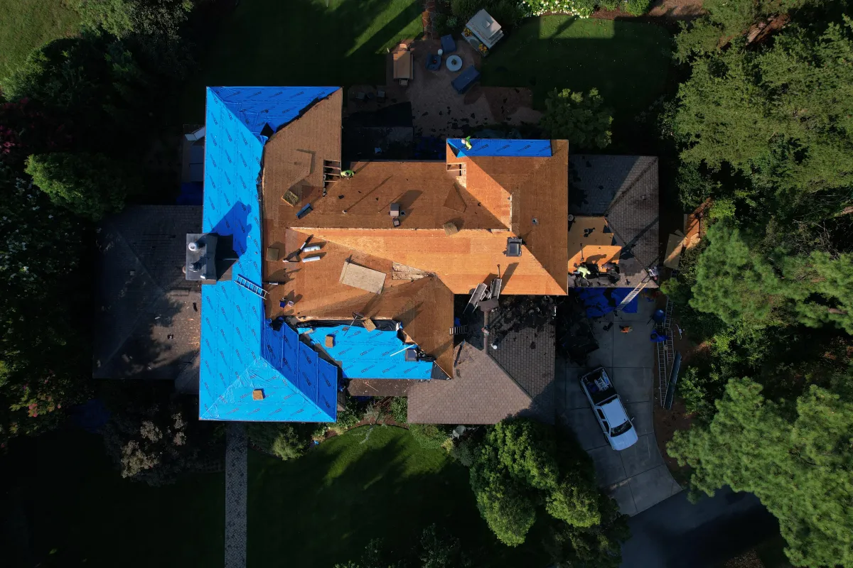 Sussex County luxury home with newly installed architectural shingle roof by Your Neighbor's Contractor, featuring perfect drainage and ridge ventilation that enhances energy efficiency and curb appeal.