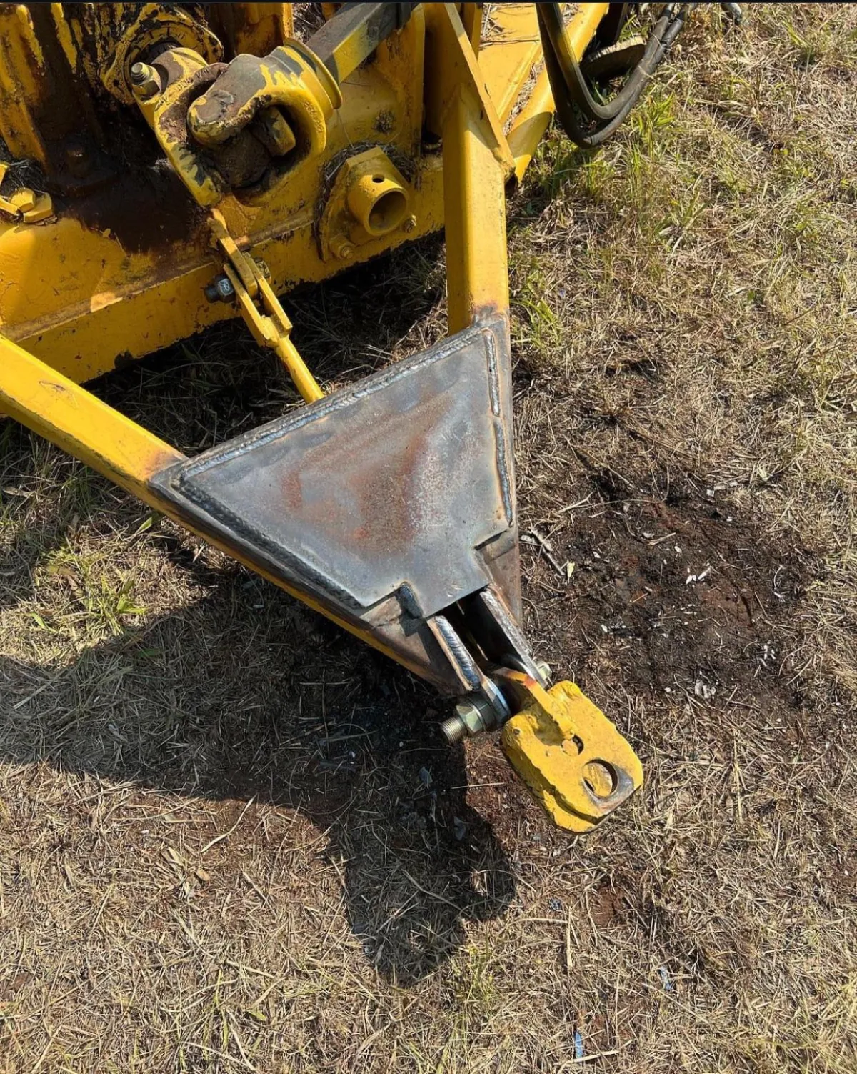 Close-up of a welded tractor attachment repair, showcasing Walker Mobile Welding's precision and expertise in mobile welding repairs in Tucson, AZ.