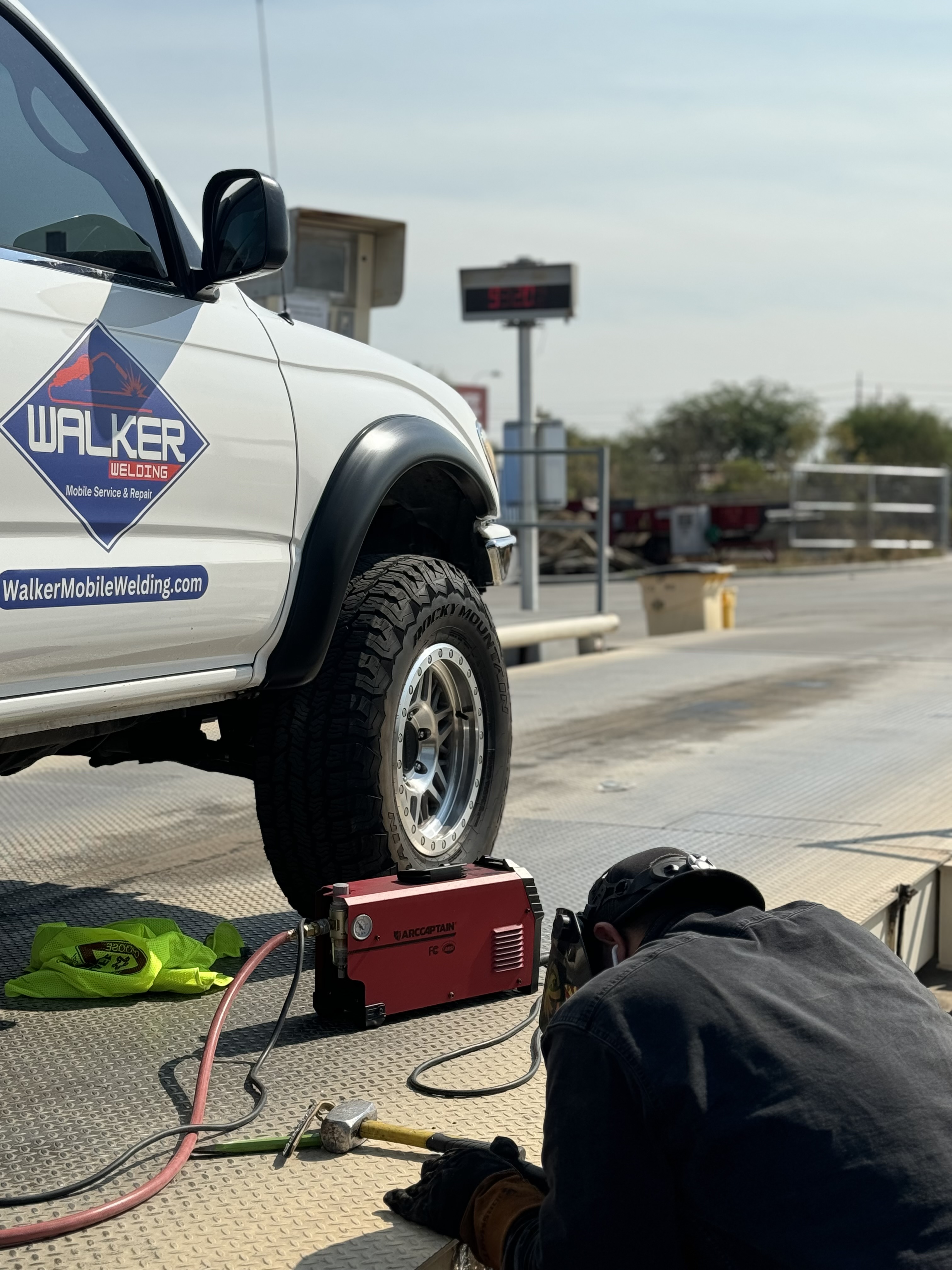 Welder in action, performing precise welding work on-site with professional equipment, representing Walker Mobile Welding's mobile welding services in Tucson, AZ.