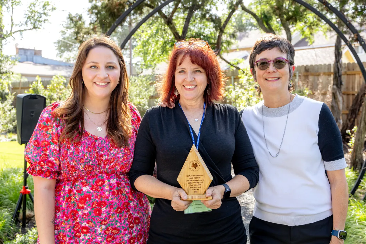 IREP's owner Kelly Dahl Johnson accepting the BeautifyTexas Business Industry award 2025