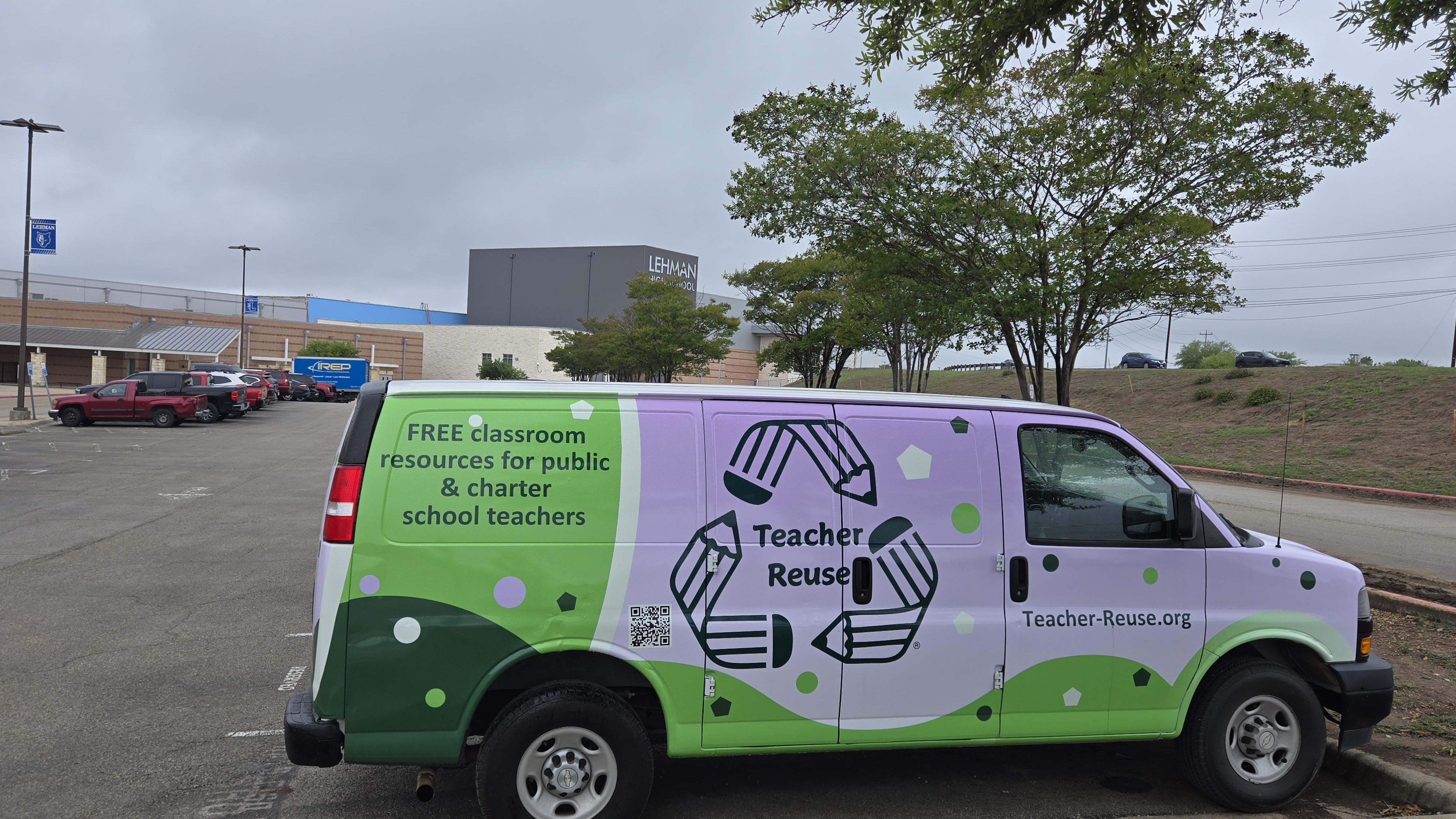 Teacher reuse Van and IREP Junk Removal truck outide Lehman High School