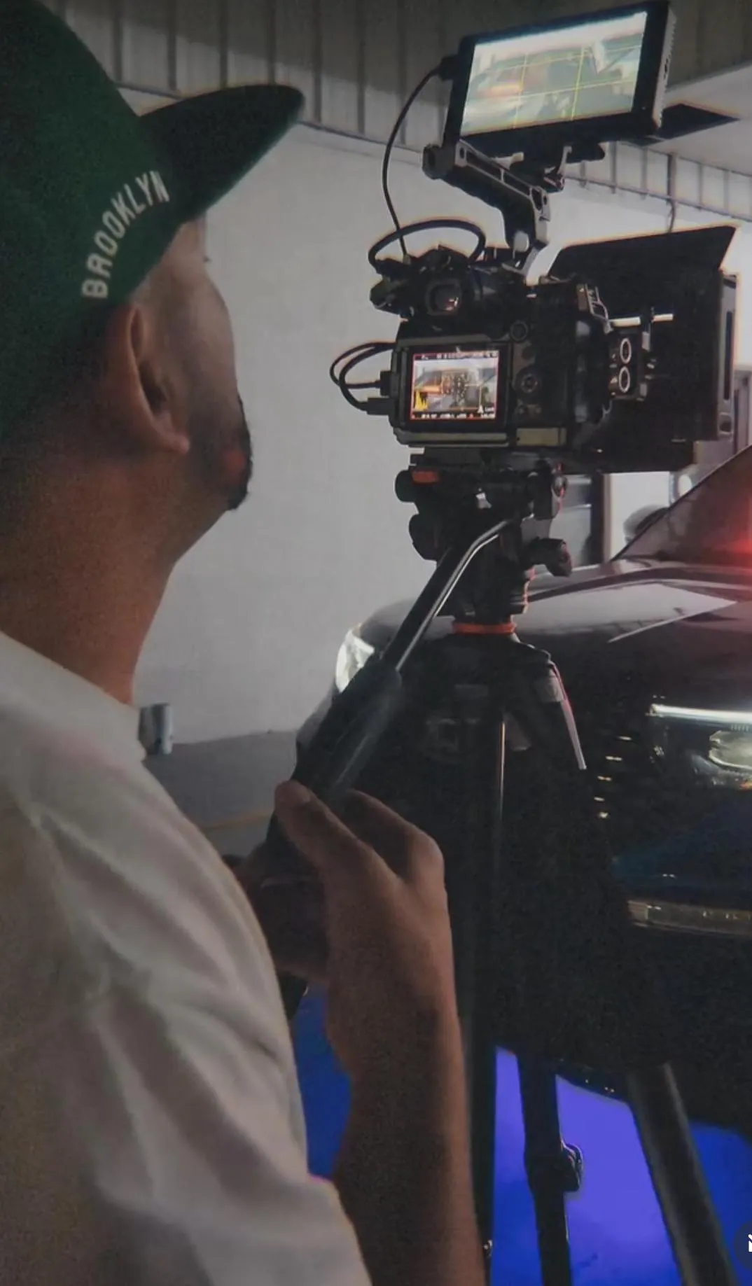 shallow focus photography of person holding camera lens