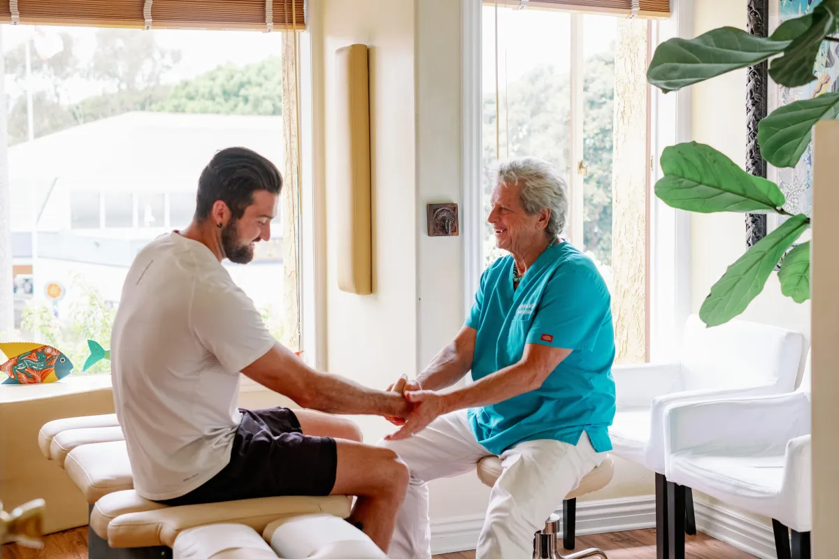 a skeleton is dancing on a pink background