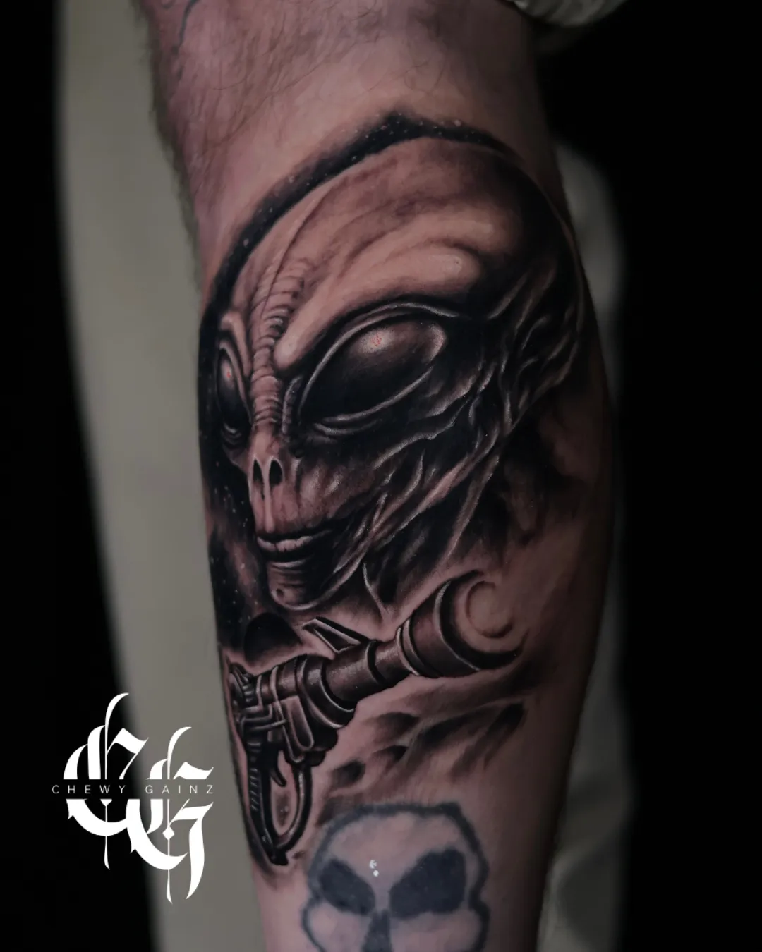 Black and grey realism and surrealism tattoo sleeve in progress on a client’s upper arm, featuring a realistic forest and river scene with a wolf stencil placement, created by a professional tattoo artist in Warren, Ohio.