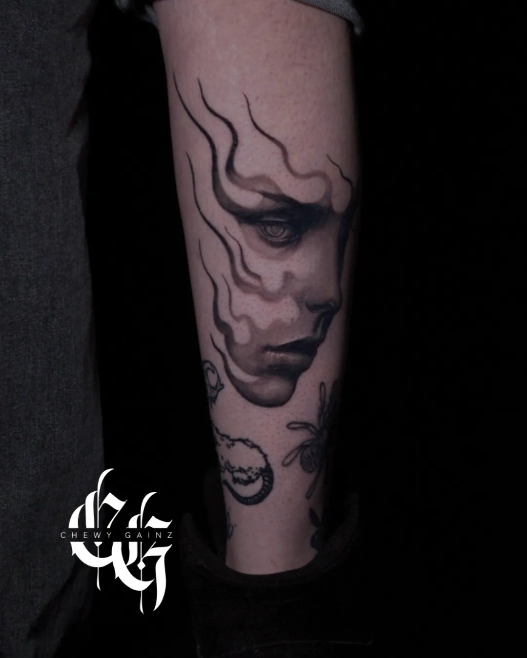 Fine-line floral back tattoo with detailed botanical linework flowing across the shoulder blade and upper back, created by a realism and surrealism tattoo artist in Warren, Ohio.