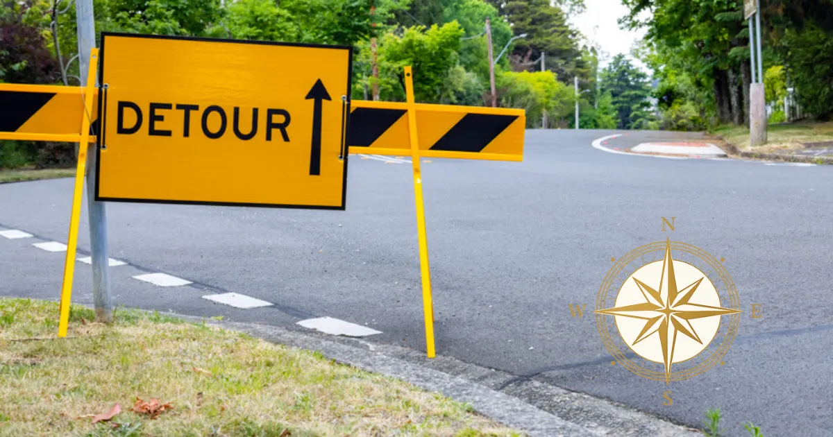 Yellow detour sign directing traffic onto a different route, symbolizing adapting to unexpected challenges.