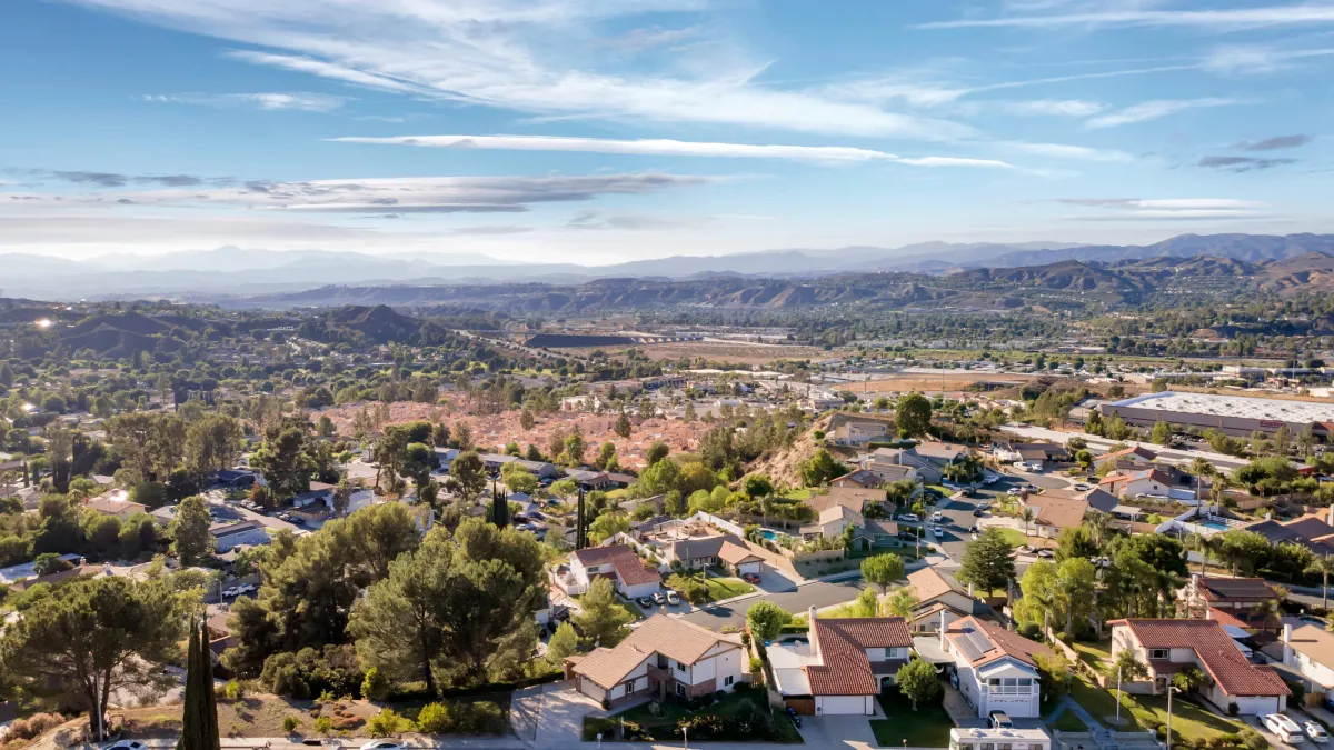 a rendering of a modern house with palm trees