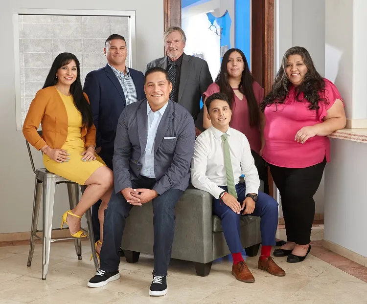a modern house with a pool in front of it