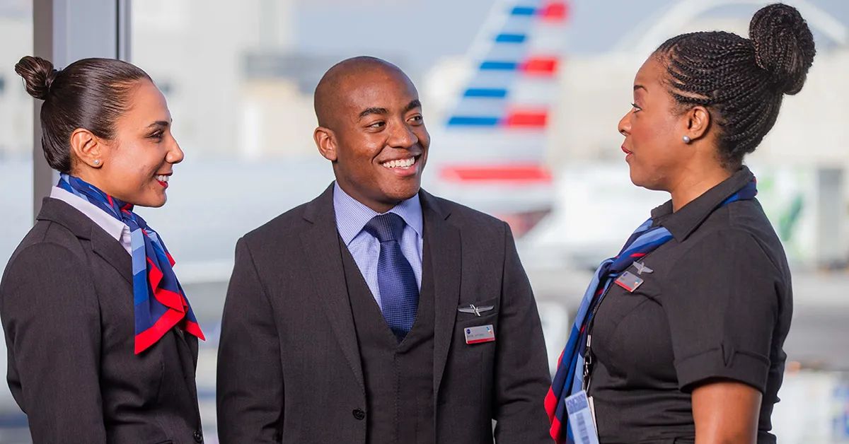 Flight Attendants having a conversation in front of AA airplane