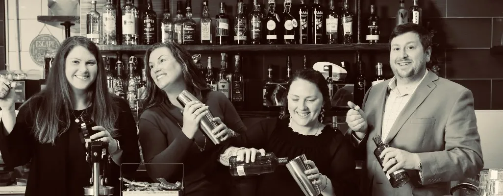 The Rushing Trading Co. family and team behind the bar: Mattie Costener, Amber Rushing, Annabel Adams, and Jason Hines