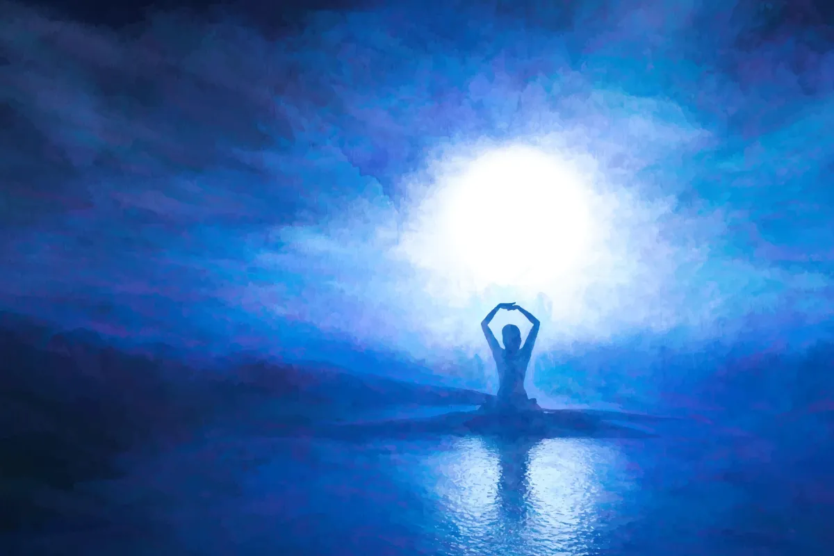 Person meditating with radiant light representing quantum healing hypnosis.