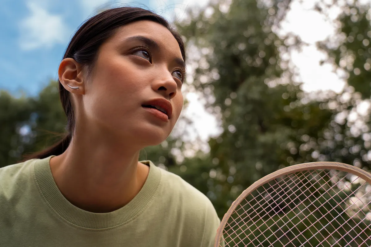 Focused woman practicing athletic visualization for peak performance.