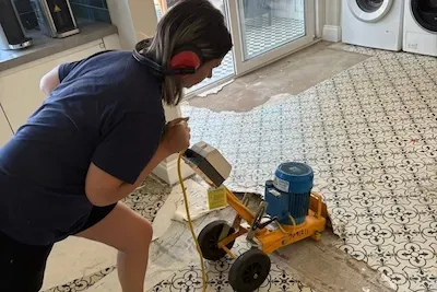 RLL team member removing an old floor