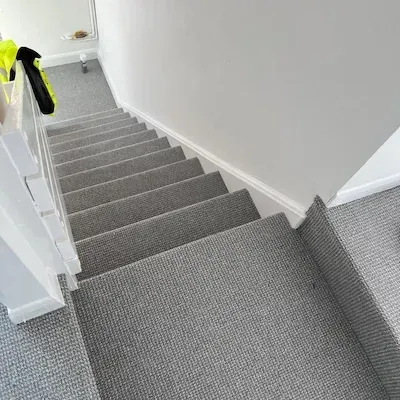 Loop pile carpet fitted on stairs and landing in a Skegness, Lincolnshire home.