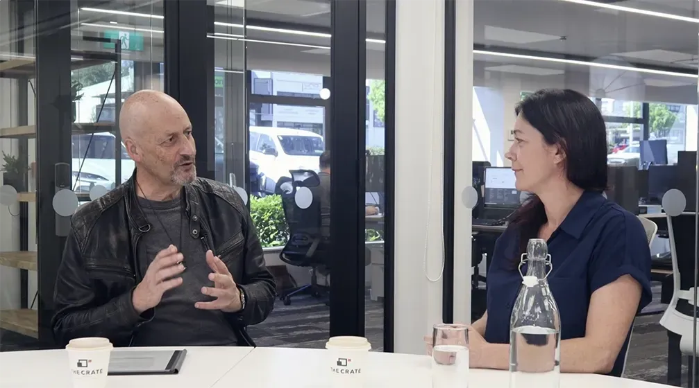 two people on a podcast recording