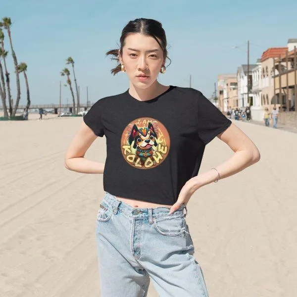 I AM KOLOHE! | Women's Flowy Cropped Tee female model on seaside street