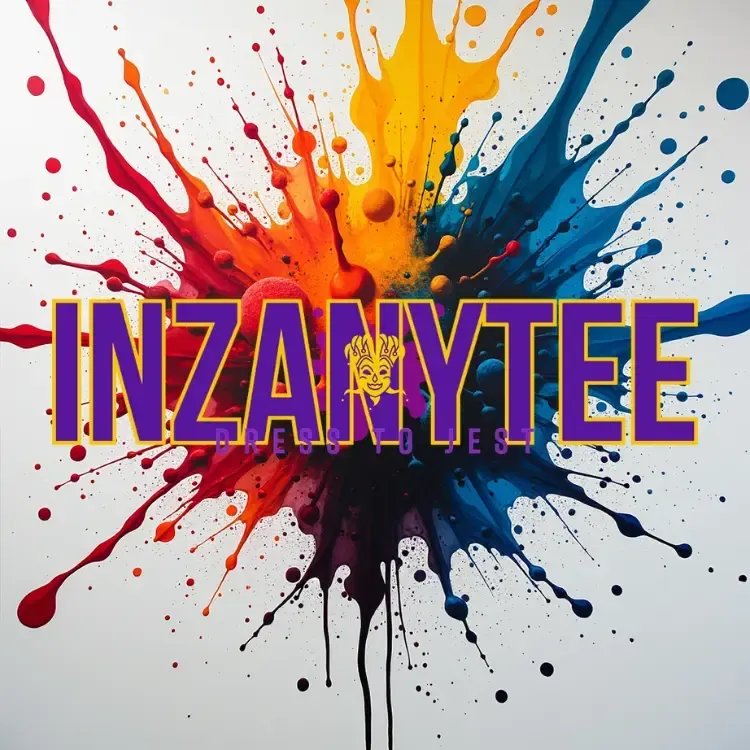 Artistic close-up of vibrant ink splatters on white fabric in a minimalist studio setting, representing the InZanytee and MadHouse wearable art collections.