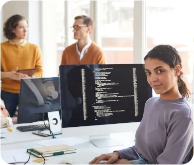 Image of a female sitting at a desk by her computer in an office ready to work on a project  symbolizing customized business roadmaps by JKC & Associates.