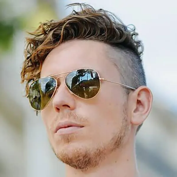 Slick back hairstyle with clean fade on the sides