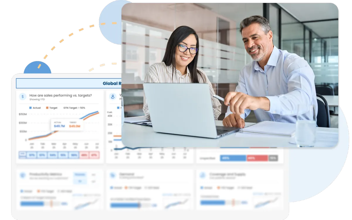 Two professionals reviewing sales data on a laptop.