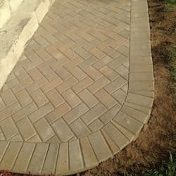 Herringbone paver walkway with curved soldier course border installed in Grafton, MA by ARM Construction