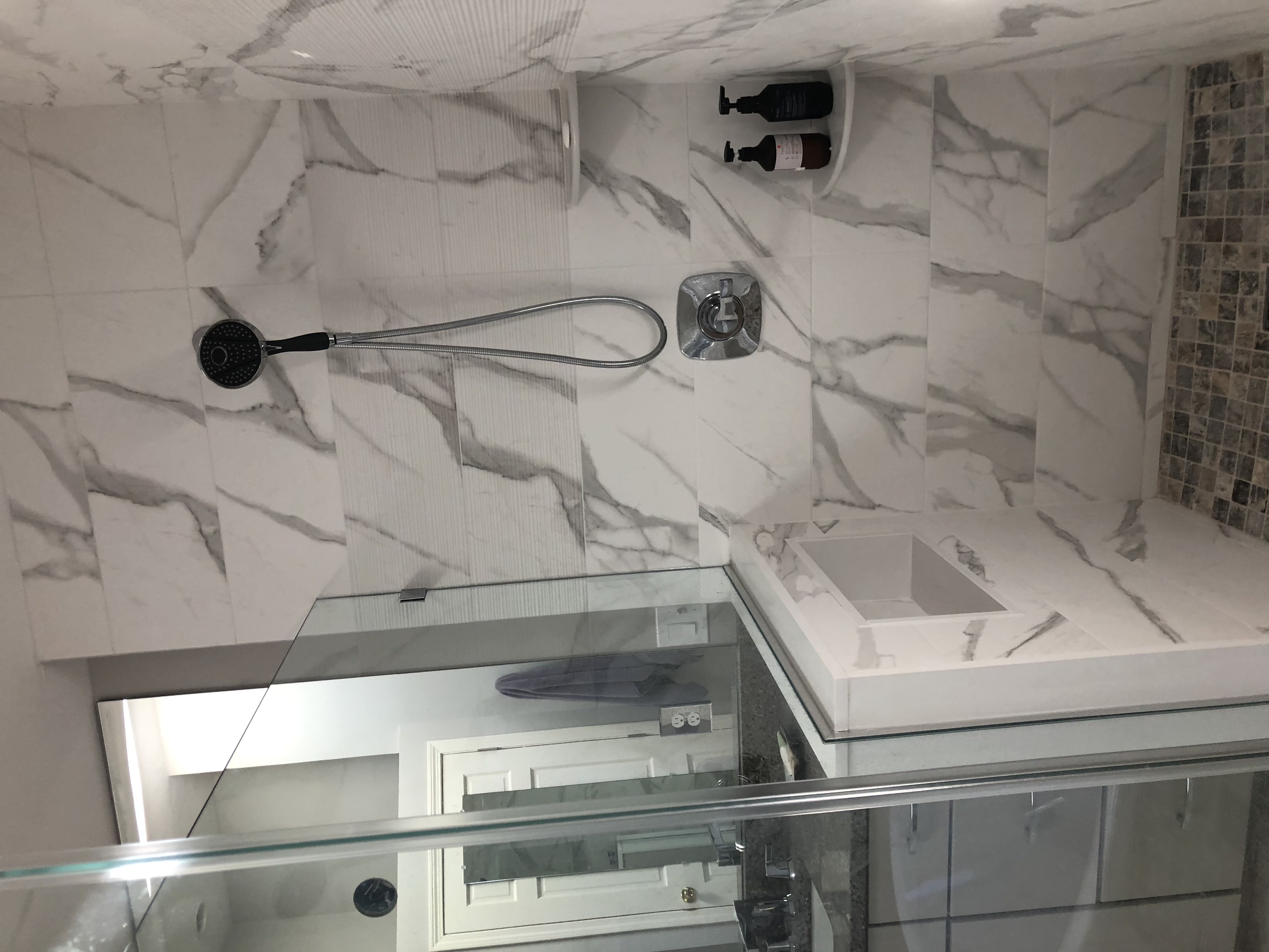 Walk-in tile shower converted from a bathtub by ARM Construction in Worcester County, MA