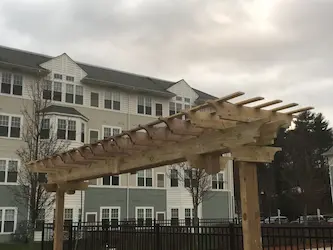 Custom timber pergola built by ARM Construction in Worcester, MA
