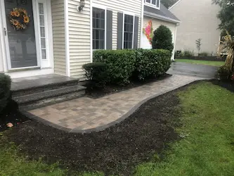 Paver walkway and entry steps with landscaping, installed by ARM Construction in Boylston, MA