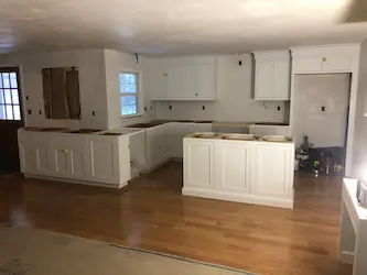 Kitchen cabinet installation in progress, by ARM Construction in West Boylston, MA
