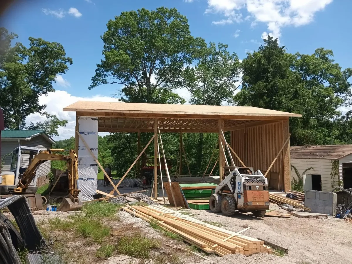 Construction of a structure in progress, machinery and wood 