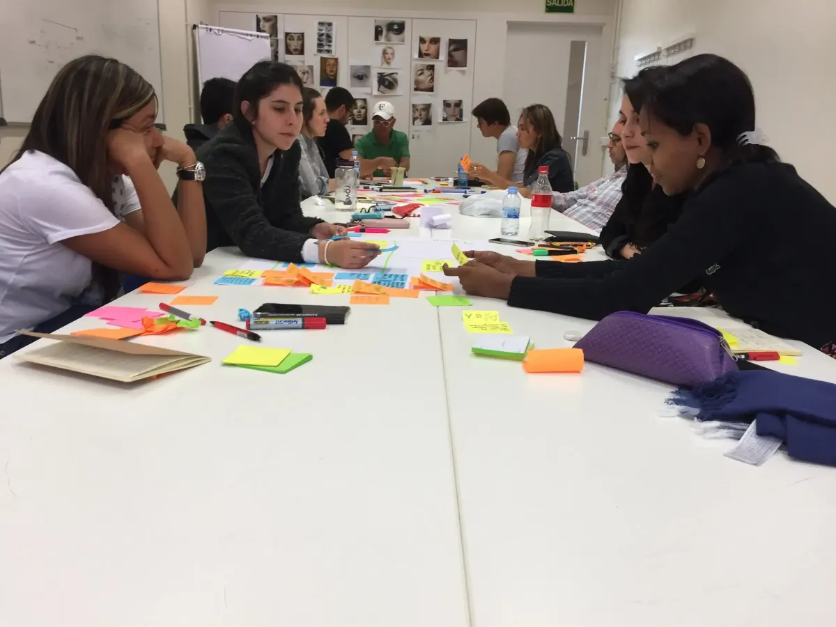 Colleagues working on sicky notes to understand and decode their users