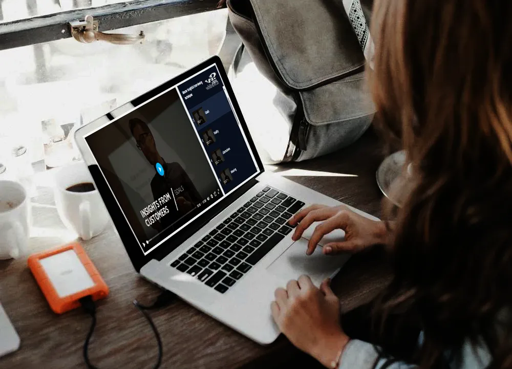 Image of a person watching pre-recorded session