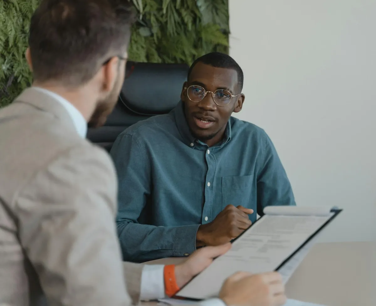 A person answering questions and leading the interview
