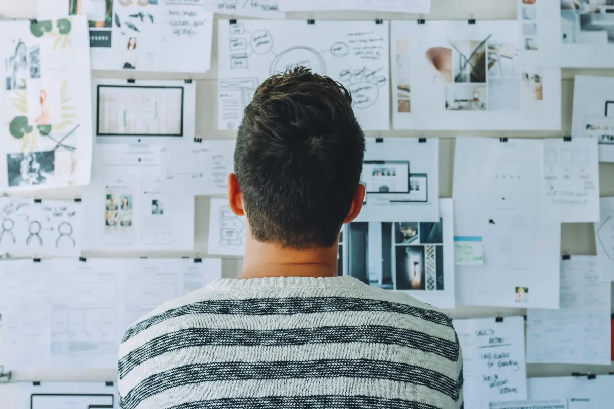 Image of person looking through mind mapPhoto by Startup Stock Photos: https://www.pexels.com/photo/man-wearing-black-and-white-stripe-shirt-looking-at-white-printer-papers-on-the-wall-212286/