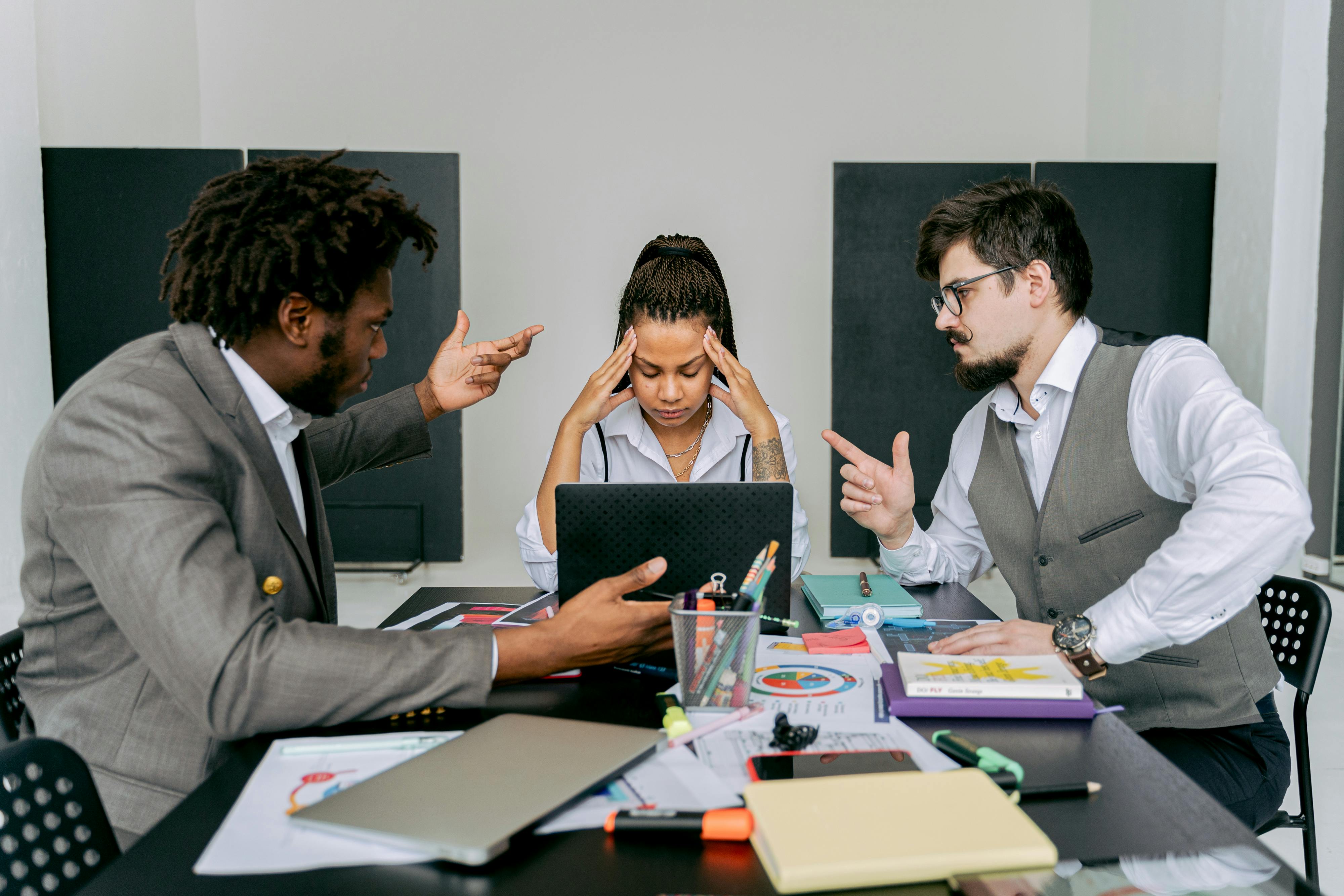 Photo by Antoni Shkraba Studio: https://www.pexels.com/photo/symmetrical-image-of-people-arguing-in-an-office-6632532/