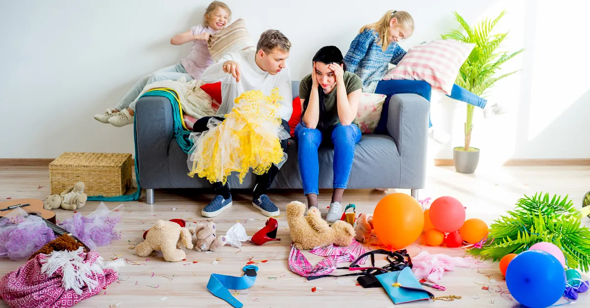 frustrated parents with messy playroom