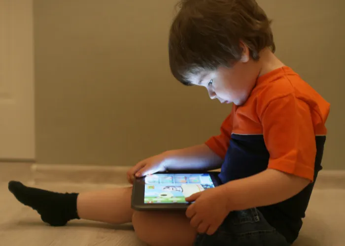 child watching tablet