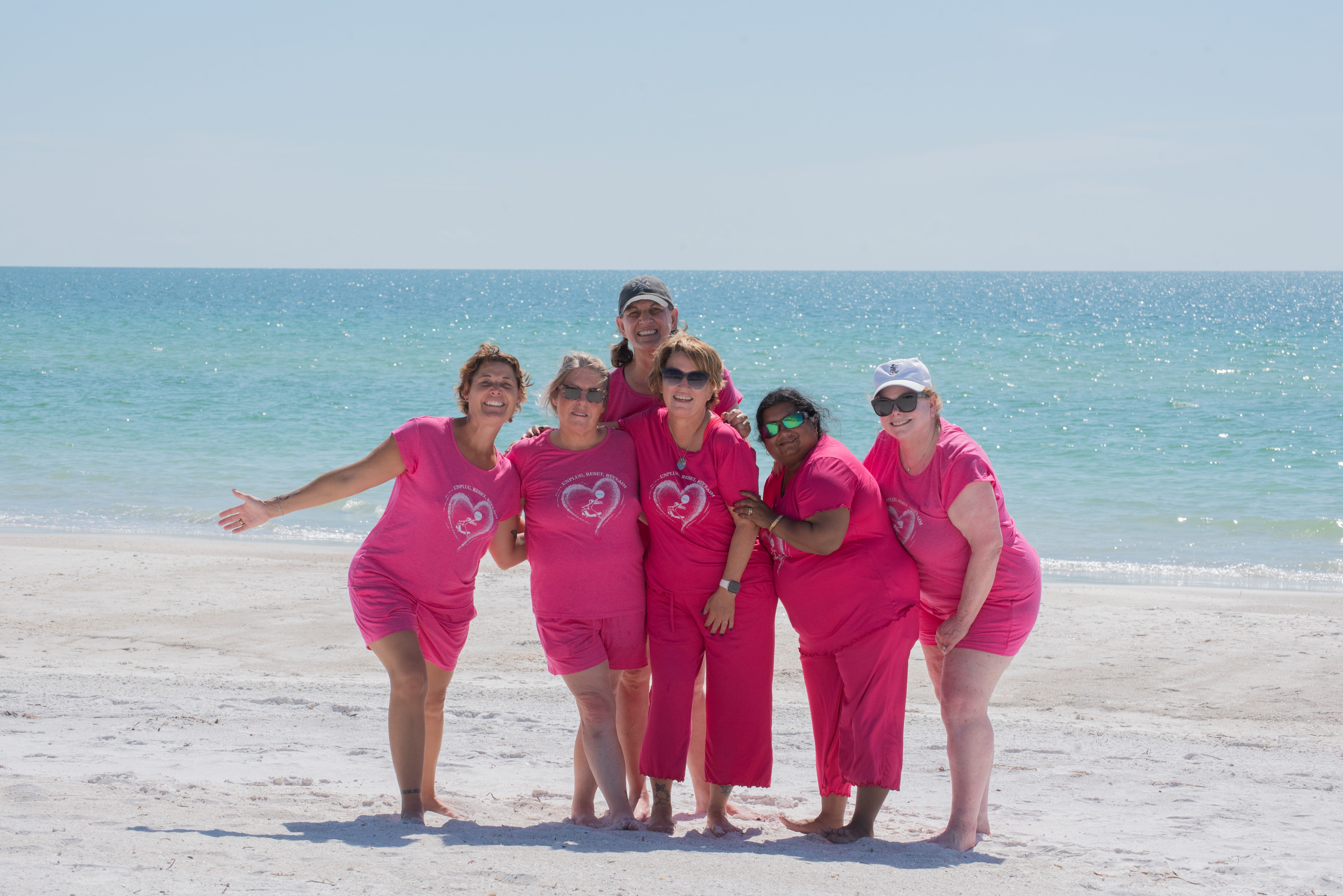 Women in pajamas on the beach