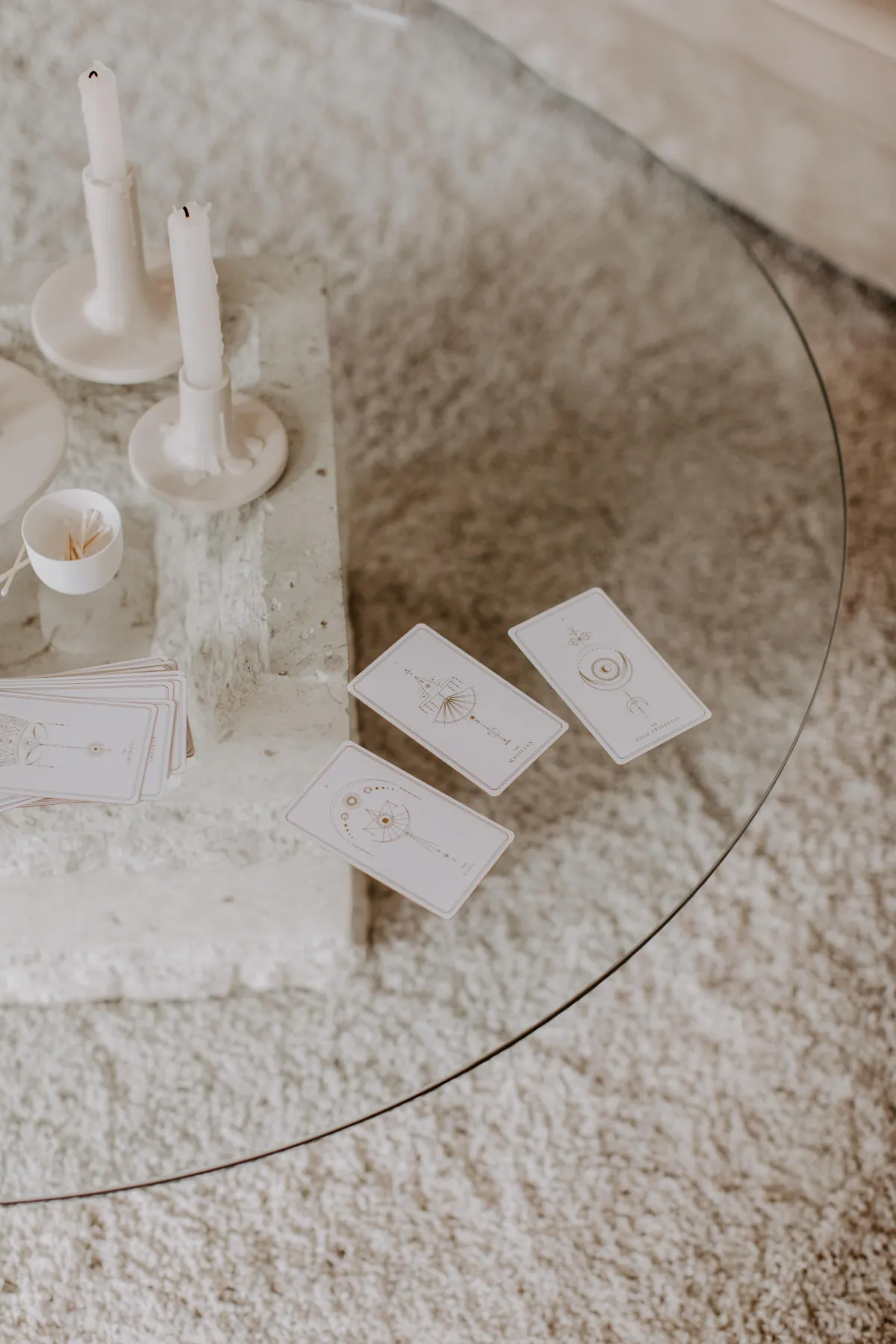 Minimal sacred space with candles, oracle cards, and soft textures — calming ritual setting for soulful home alignment