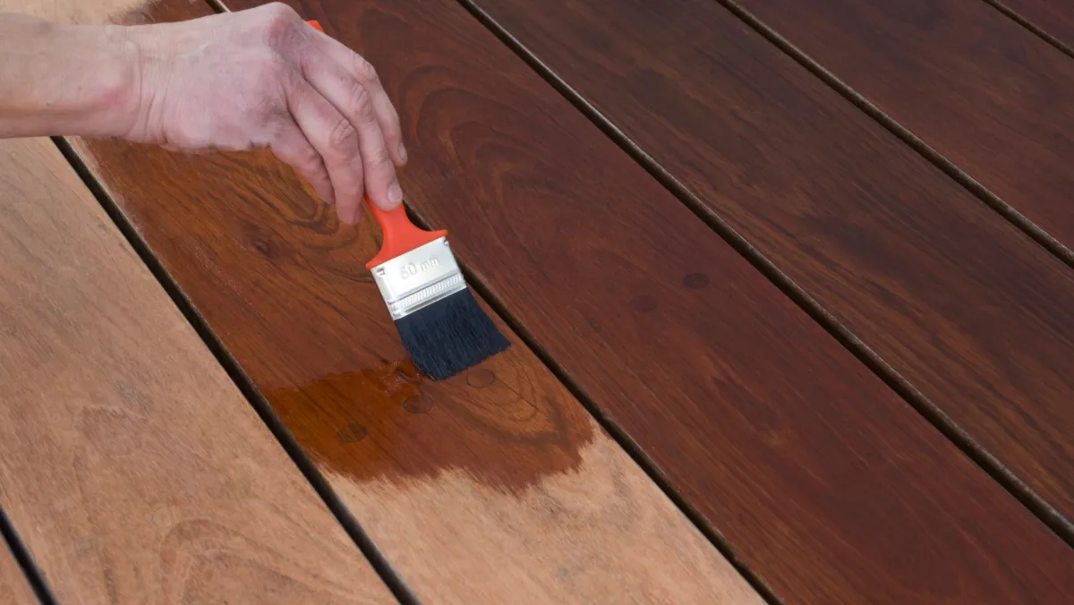 Photo of a deck being stained.