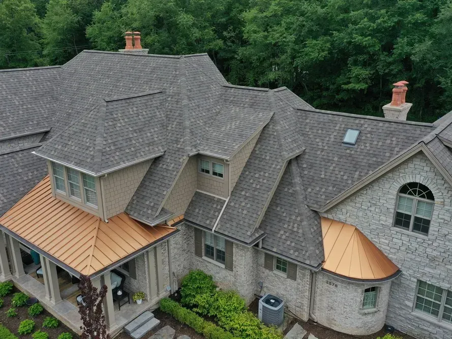 A roof with new asphalt shingles on it.