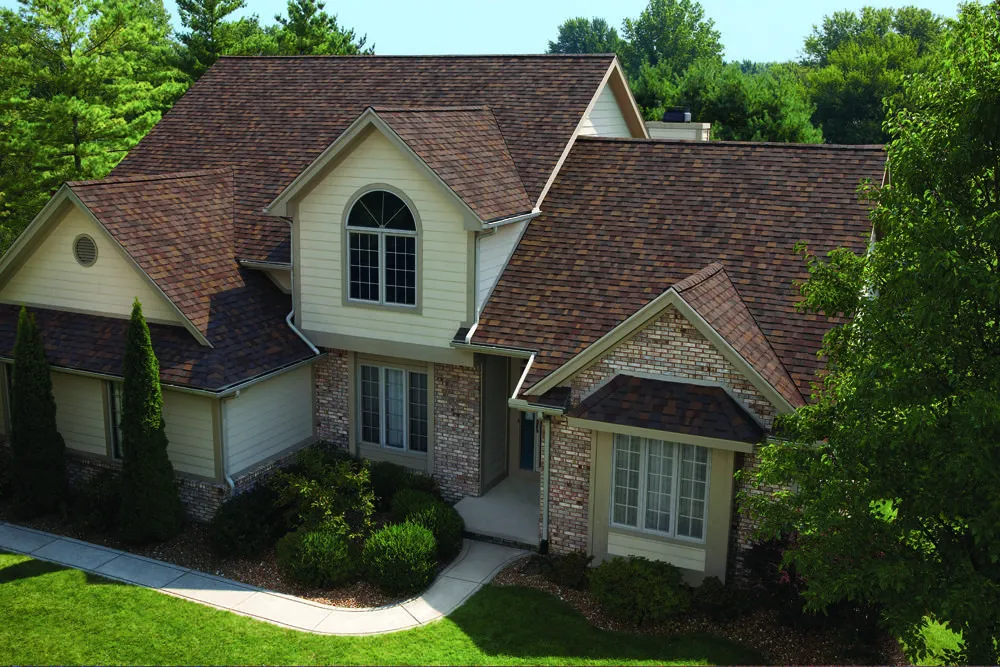Residential roof with professionally installed shingles by certified roofing contractor