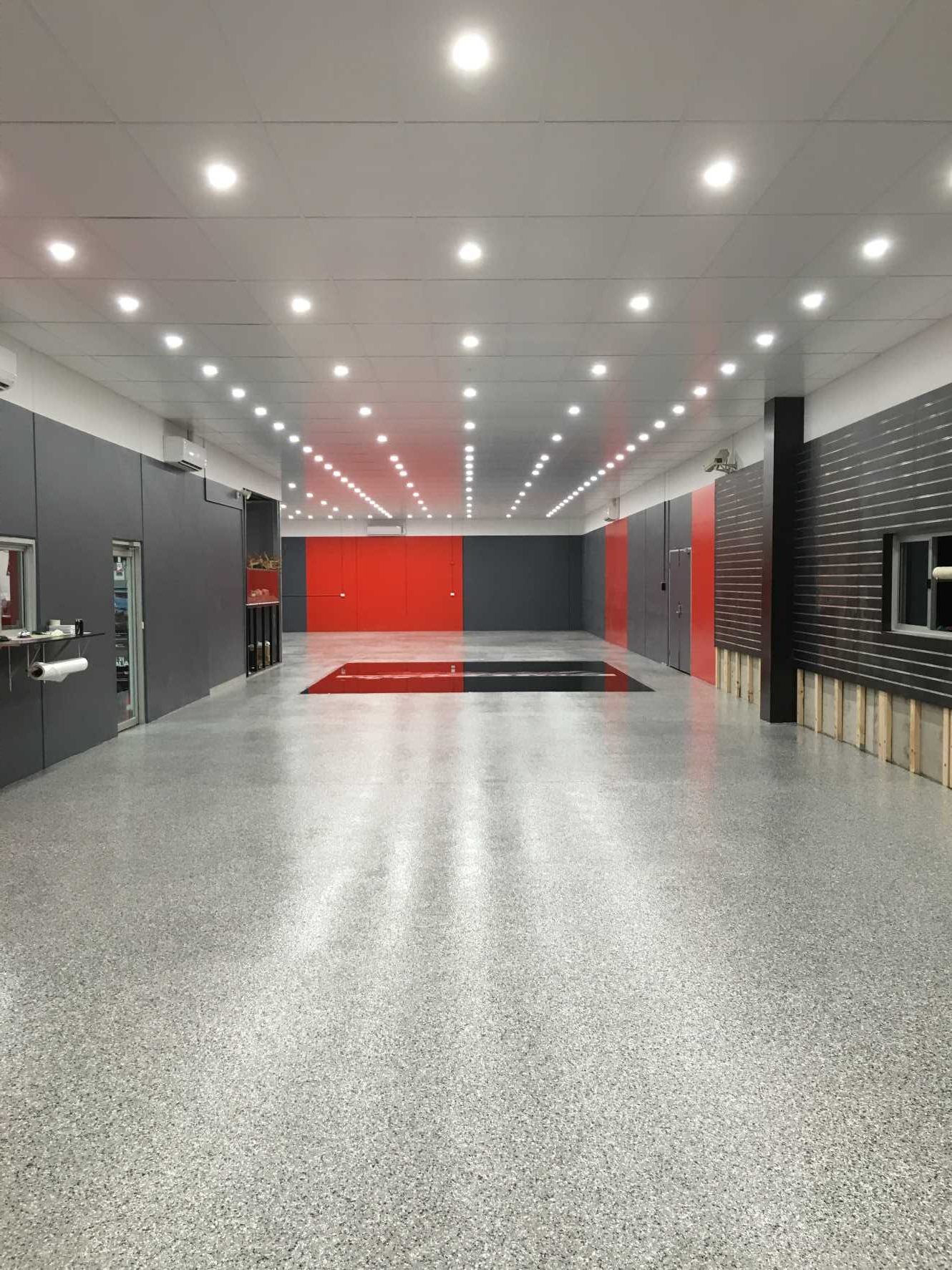 Grey epoxy flake floor in commercial fitout
