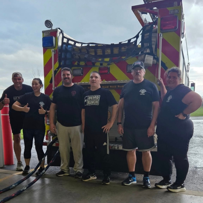 group picture of department training with individuals